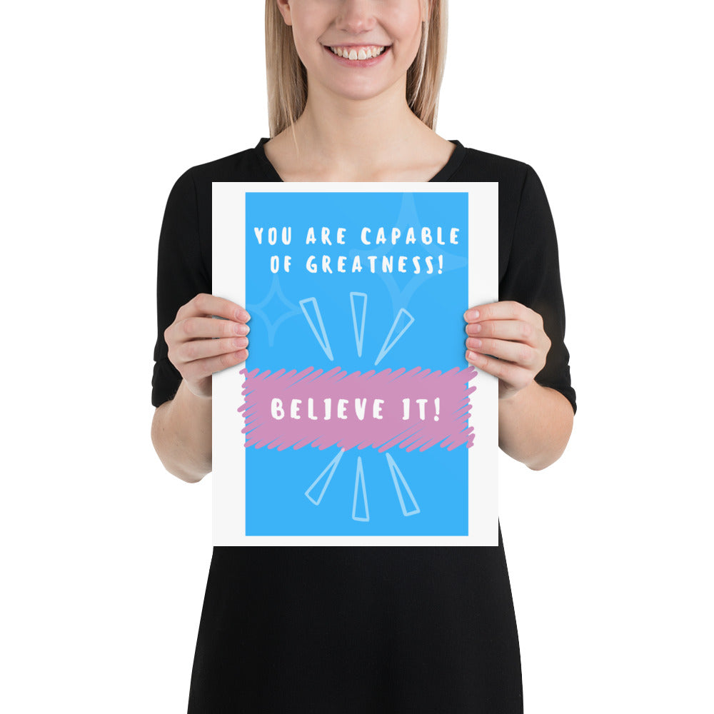 Front facing blue with pink stripe thin canvas wall decor with the phrase, You are capable of greatness! Believe it!. Size 11x14 inches.