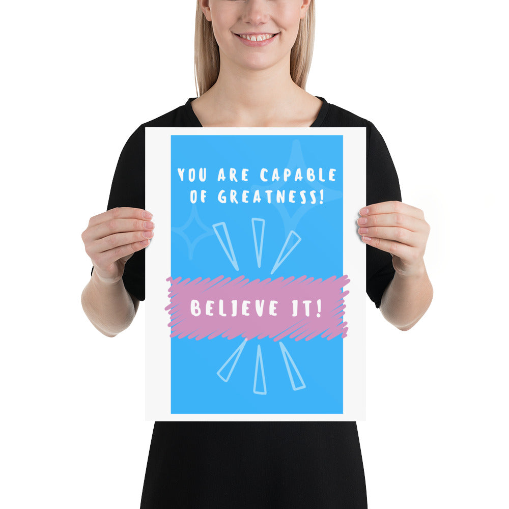 Front facing blue with pink stripe thin canvas wall decor with the phrase, You are capable of greatness! Believe it!. Size 12x16 inches.