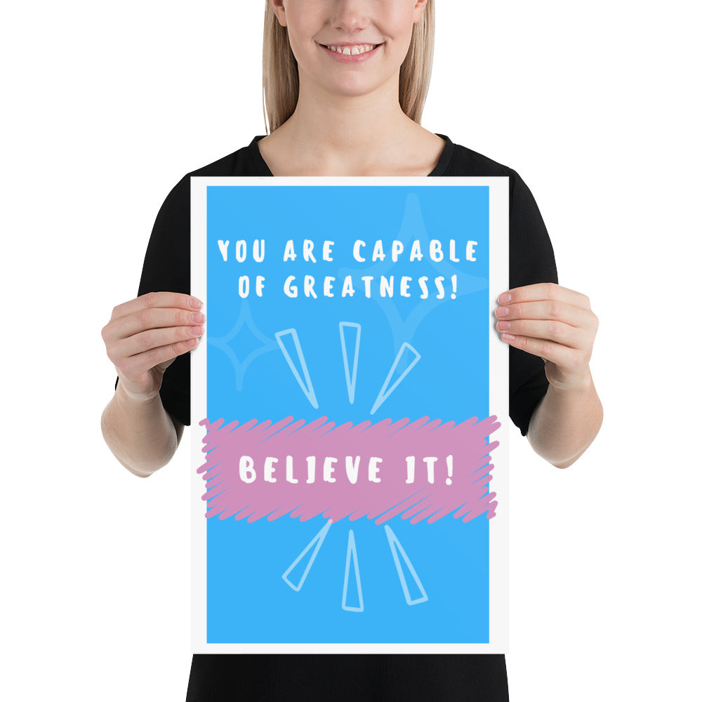 Front facing blue with pink stripe thin canvas wall decor with the phrase, You are capable of greatness! Believe it!. Size 12x18 inches.