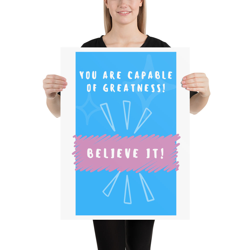 Front facing blue with pink stripe thin canvas wall decor with the phrase, You are capable of greatness! Believe it!. Size 18x24 inches.