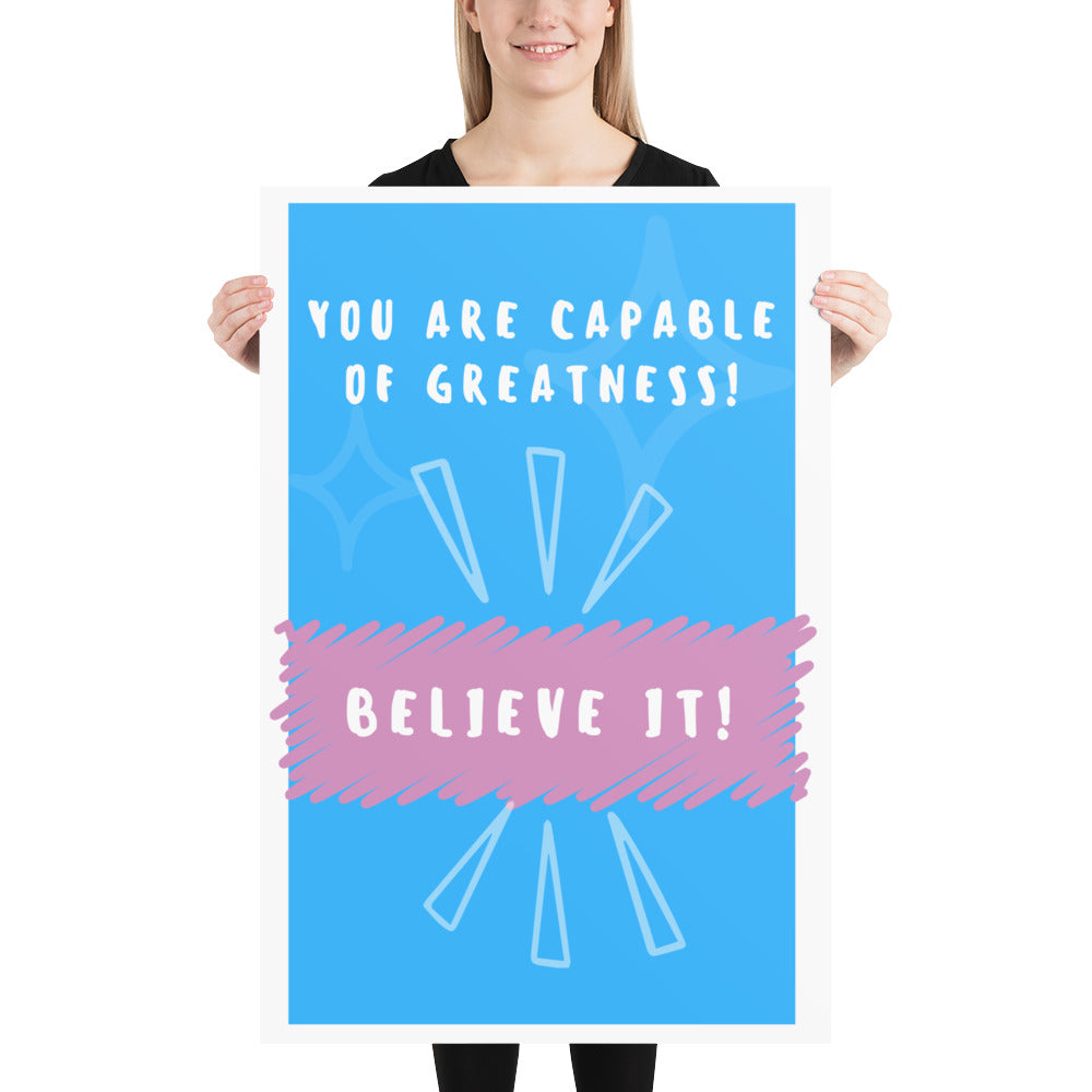 Front facing blue with pink stripe thin canvas wall decor with the phrase, You are capable of greatness! Believe it!. Size 24x36 inches.