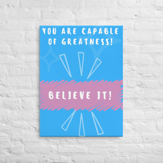 Front facing blue with pink stripe thin canvas wall decor with the phrase, You are capable of greatness! Believe it! Size 24x32 inches.