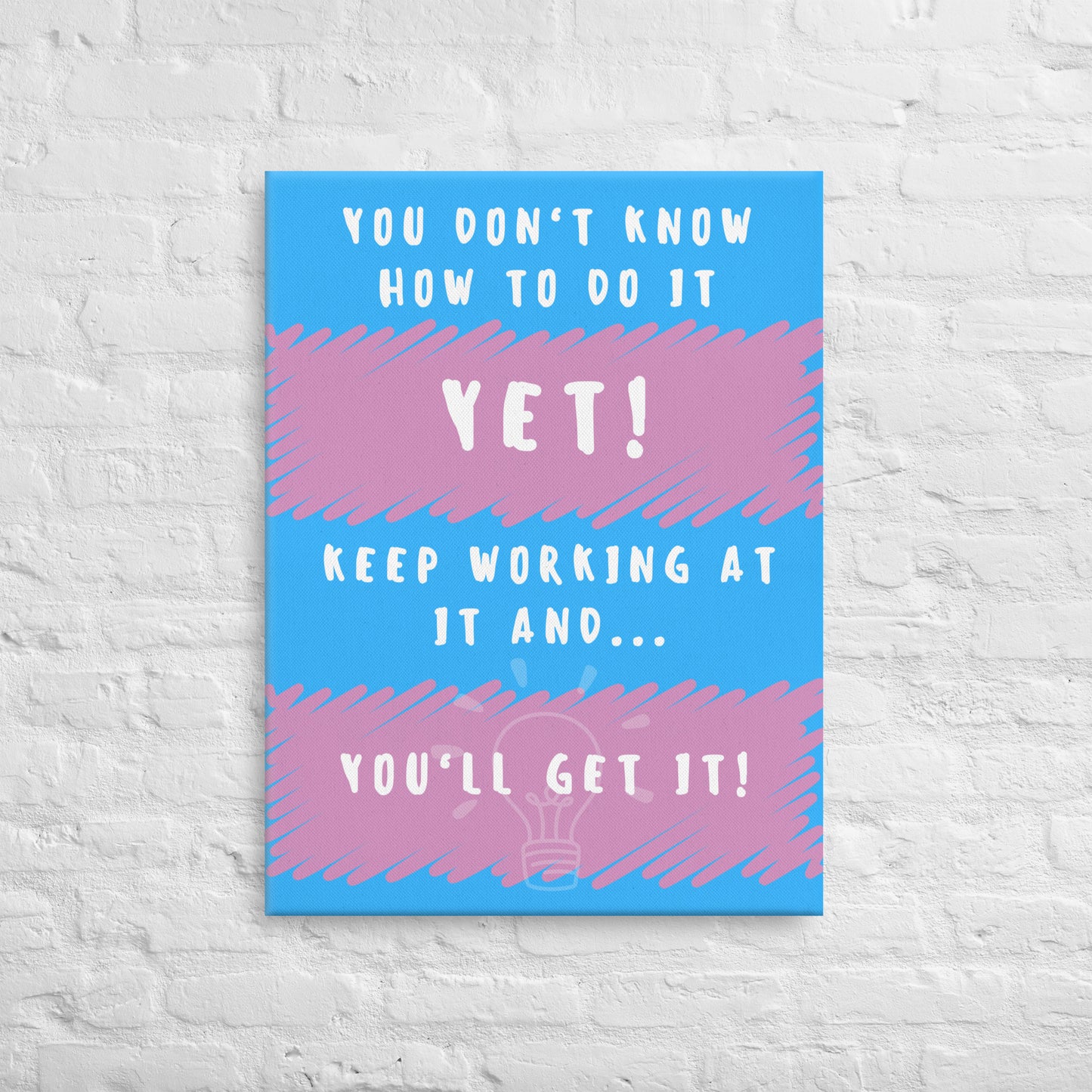 Front facing pink and blue striped thin canvas wall decor with the phrase You don't know how to do it yet! Keep working at it and...you'll get it. Size 24x32 inches.