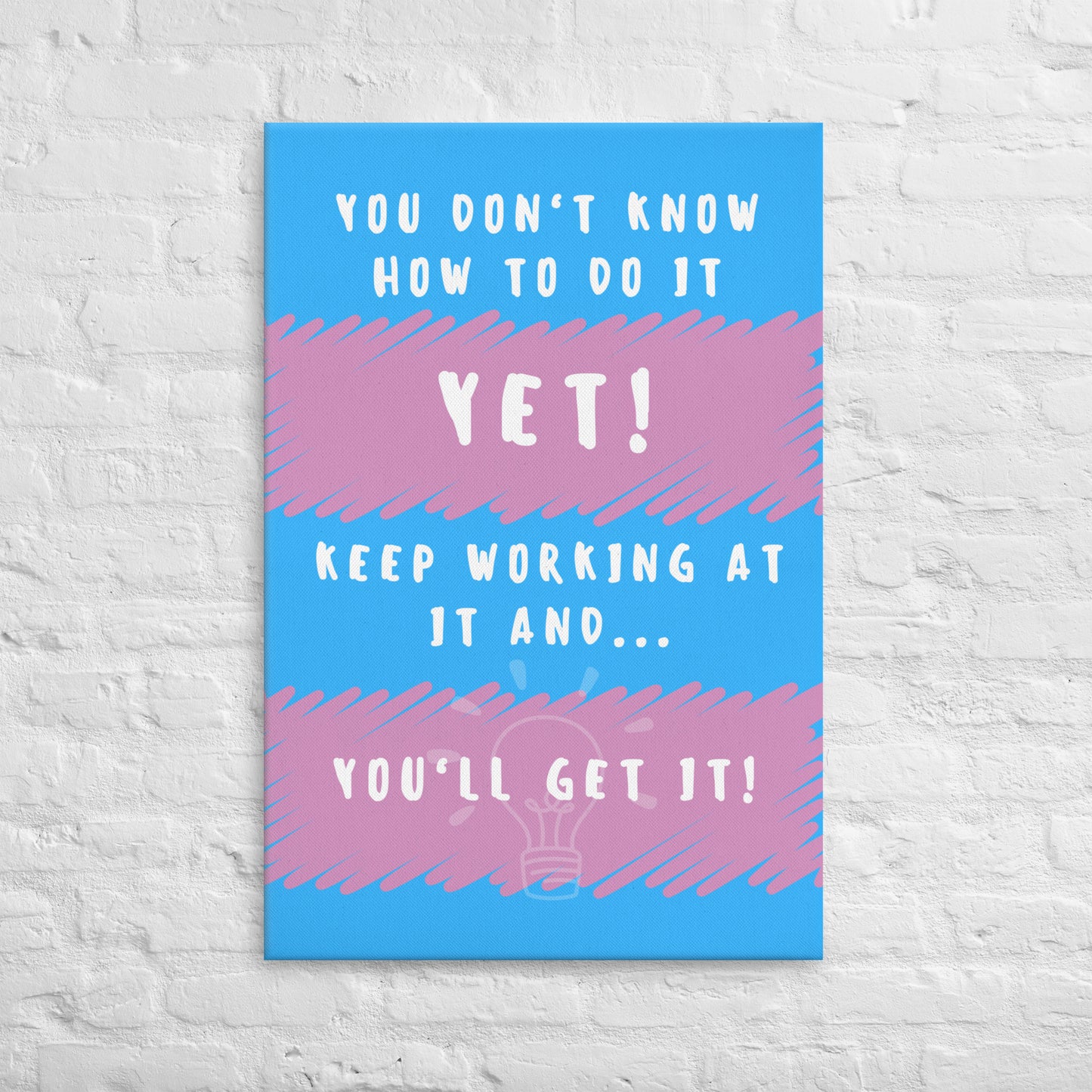 Front facing pink and blue striped thin canvas wall decor with the phrase You don't know how to do it yet! Keep working at it and...you'll get it. Size 24x36 inches.